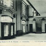 A black and white photo of the inner-pillar doors within 181 Higgins during the 19th century.