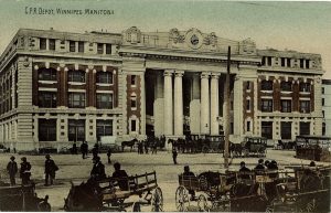 a colored photo of 181 Higgins, with many horse wagons on the road. 19th century.