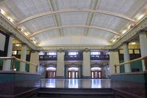 Photo of 181 Higgins rotunda, facing the pillar doors entryway.