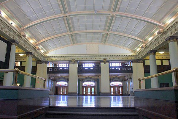 Photo of 181 Higgins rotunda, facing the pillar doors entryway.